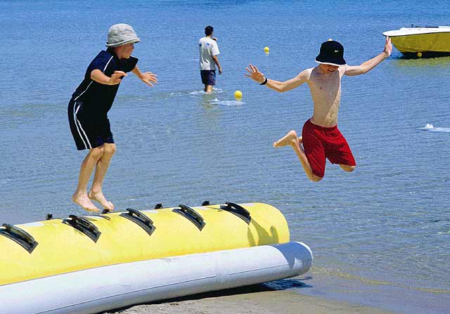 BOYS JUMPING IN THE SEA - 