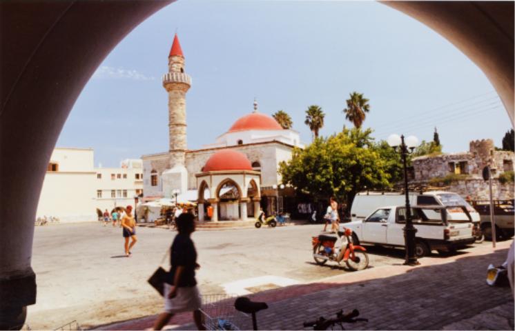 KOS TOWN - One of the liveliest and most attractive of the Greek Island capitals Kos Town is full of palm trees and flowers with many archaeological remains and imposing Venetian-style buildings...
 by Derek Oakley